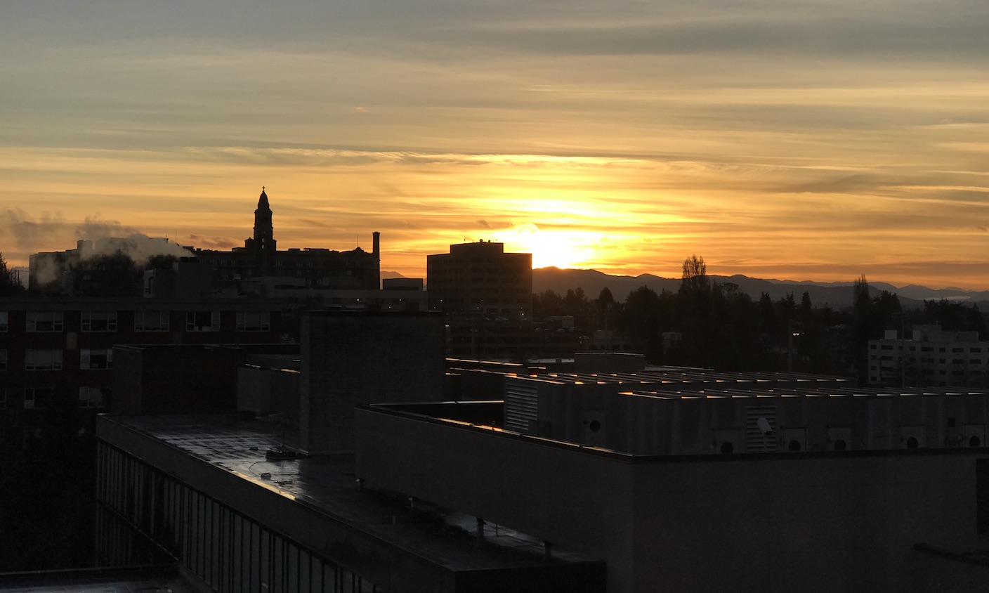 Seattle University sunrise over building tops